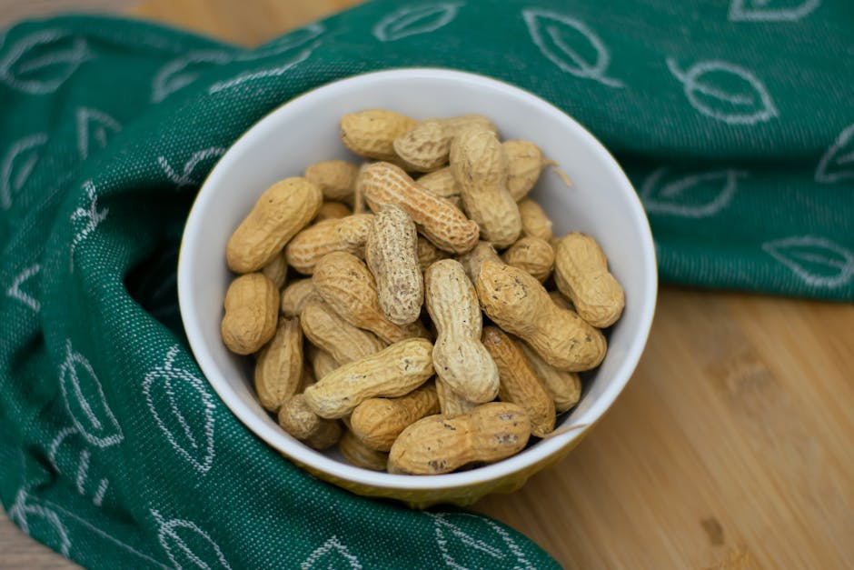A bowl of peanuts in shells, one of the few non-grape USDA-tracked dietary sources of resveratrol